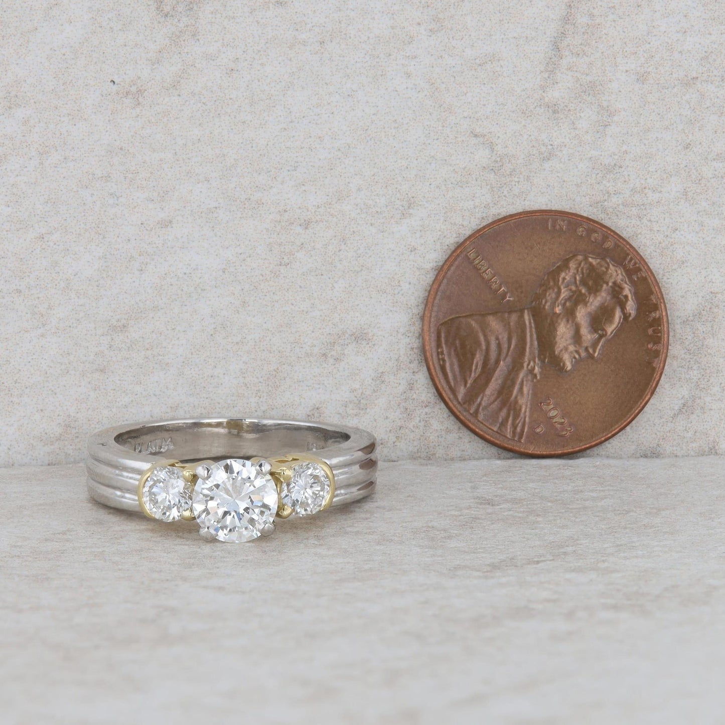 Platinum and 18k Yellow Gold Three Stone Diamond Ring