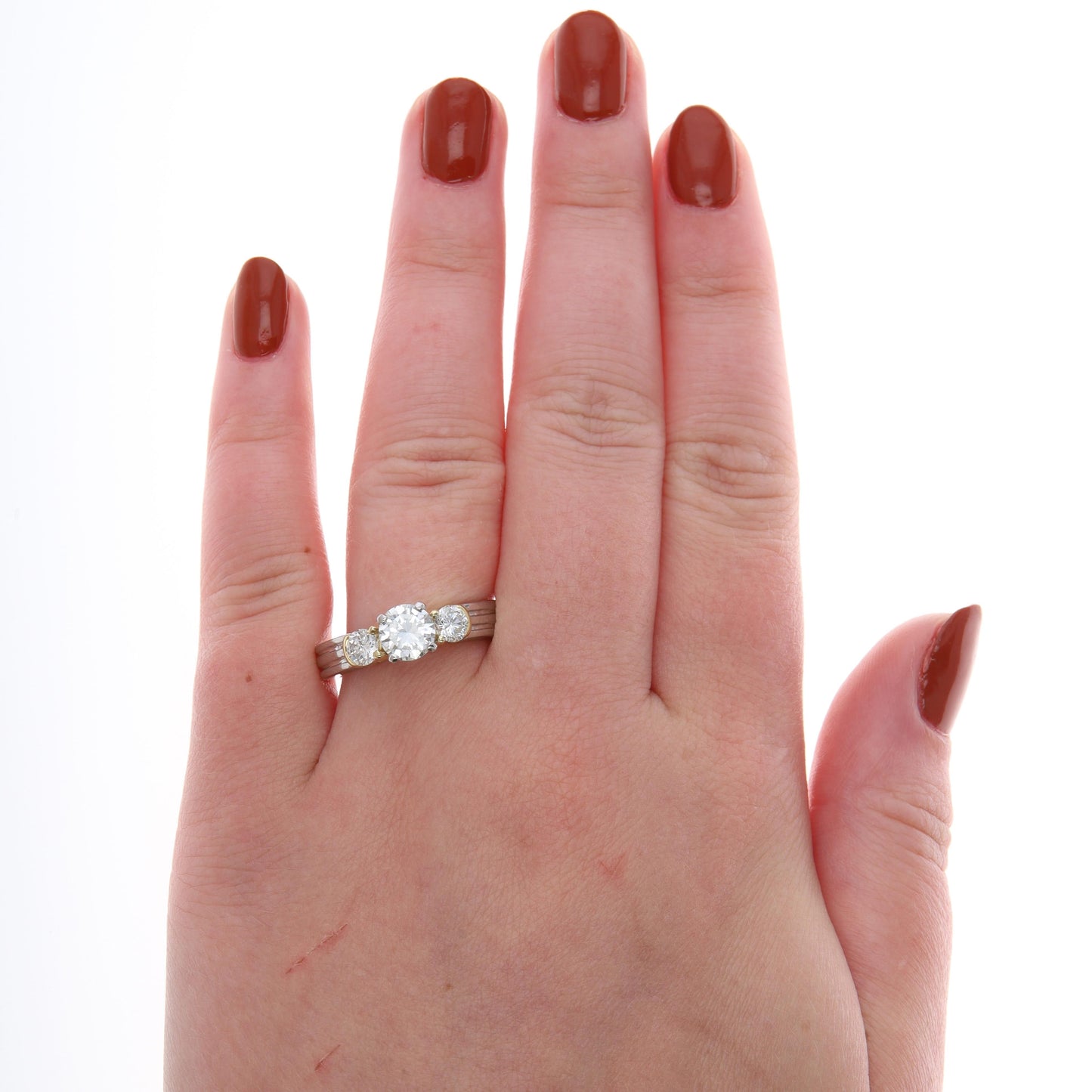 Platinum and 18k Yellow Gold Three Stone Diamond Ring