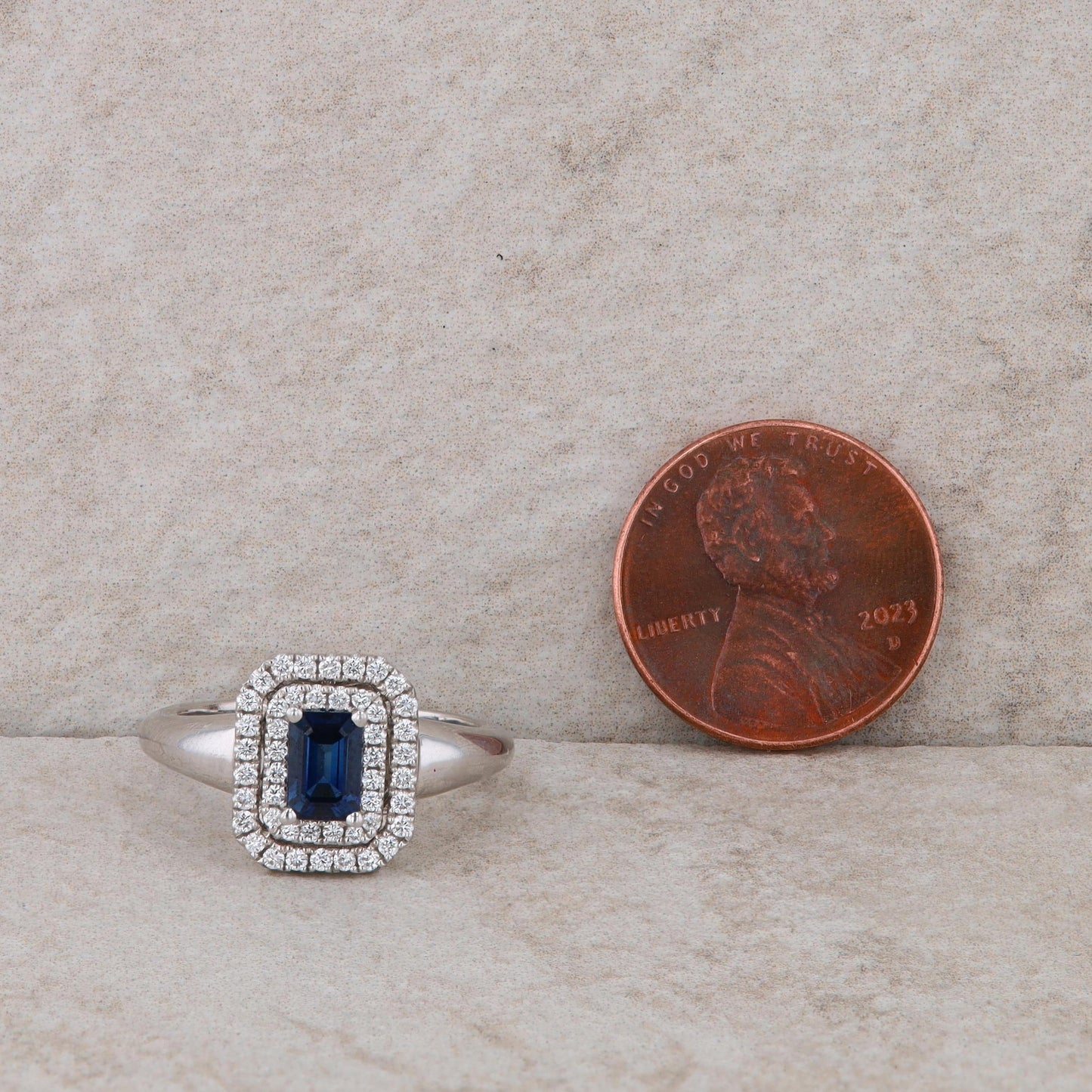 Spark 18k White Gold Emerald Cut Sapphire and Double Halo Diamond Ring