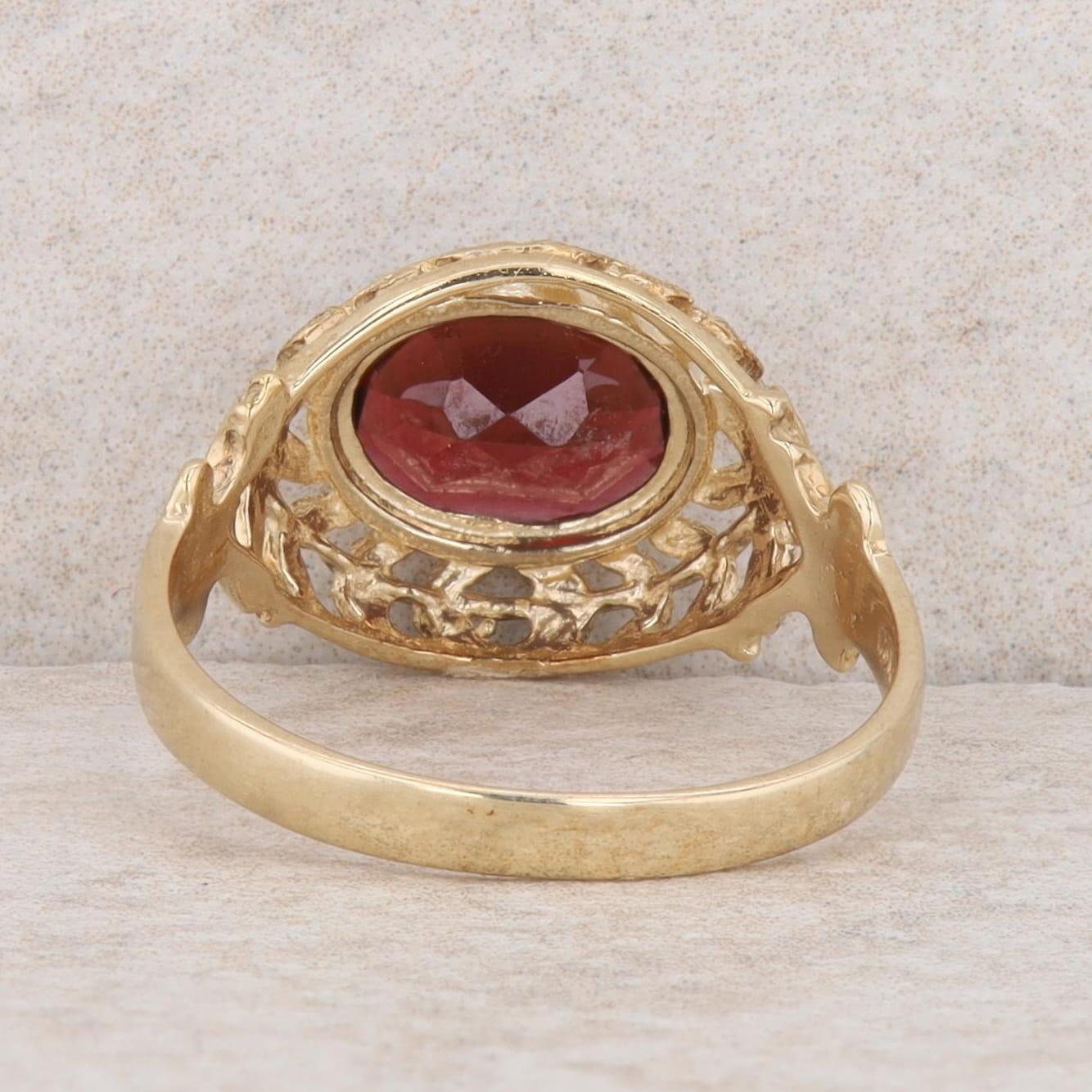 10k Yellow Gold Oval Garnet East/West Set Leaf Filigree Ring, Finger Size 7.25