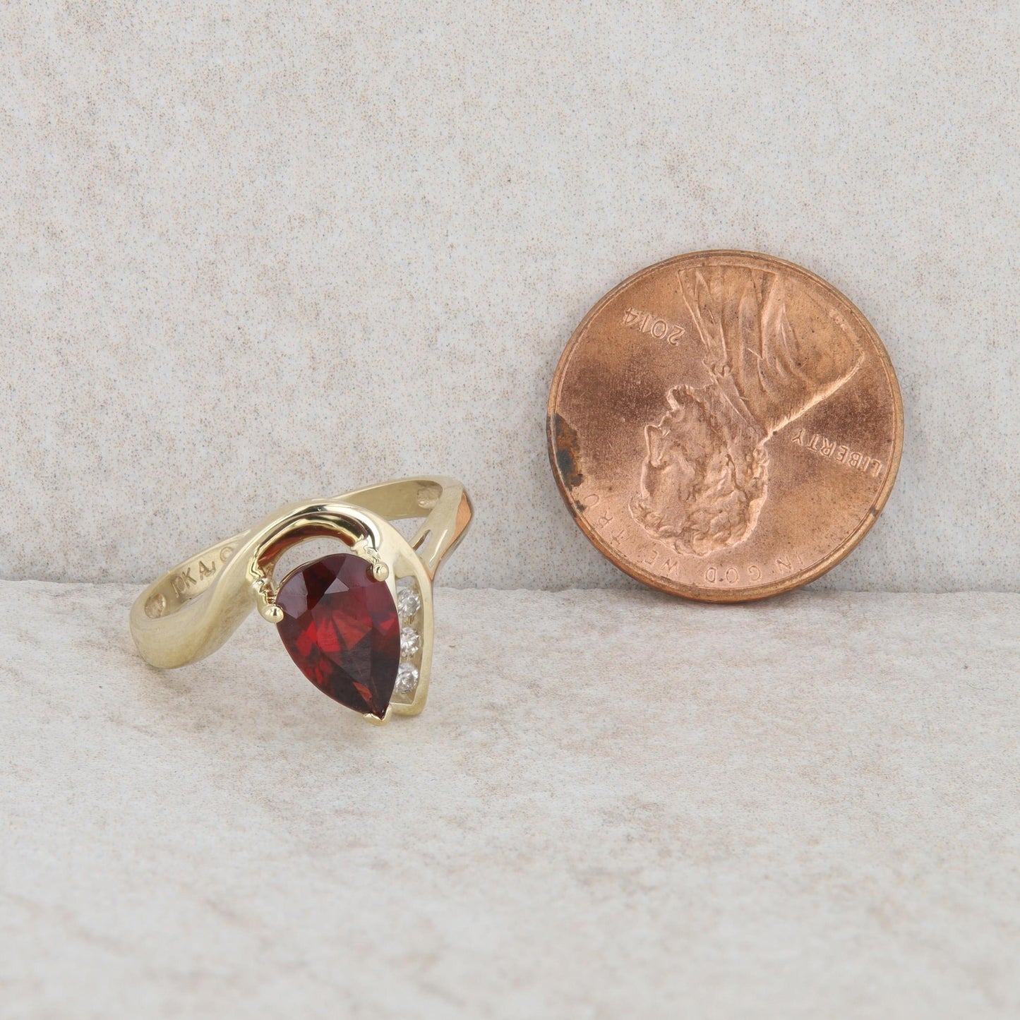 10k Yellow Gold Pear Mozambique Garnet & Diamond Curved Ring
