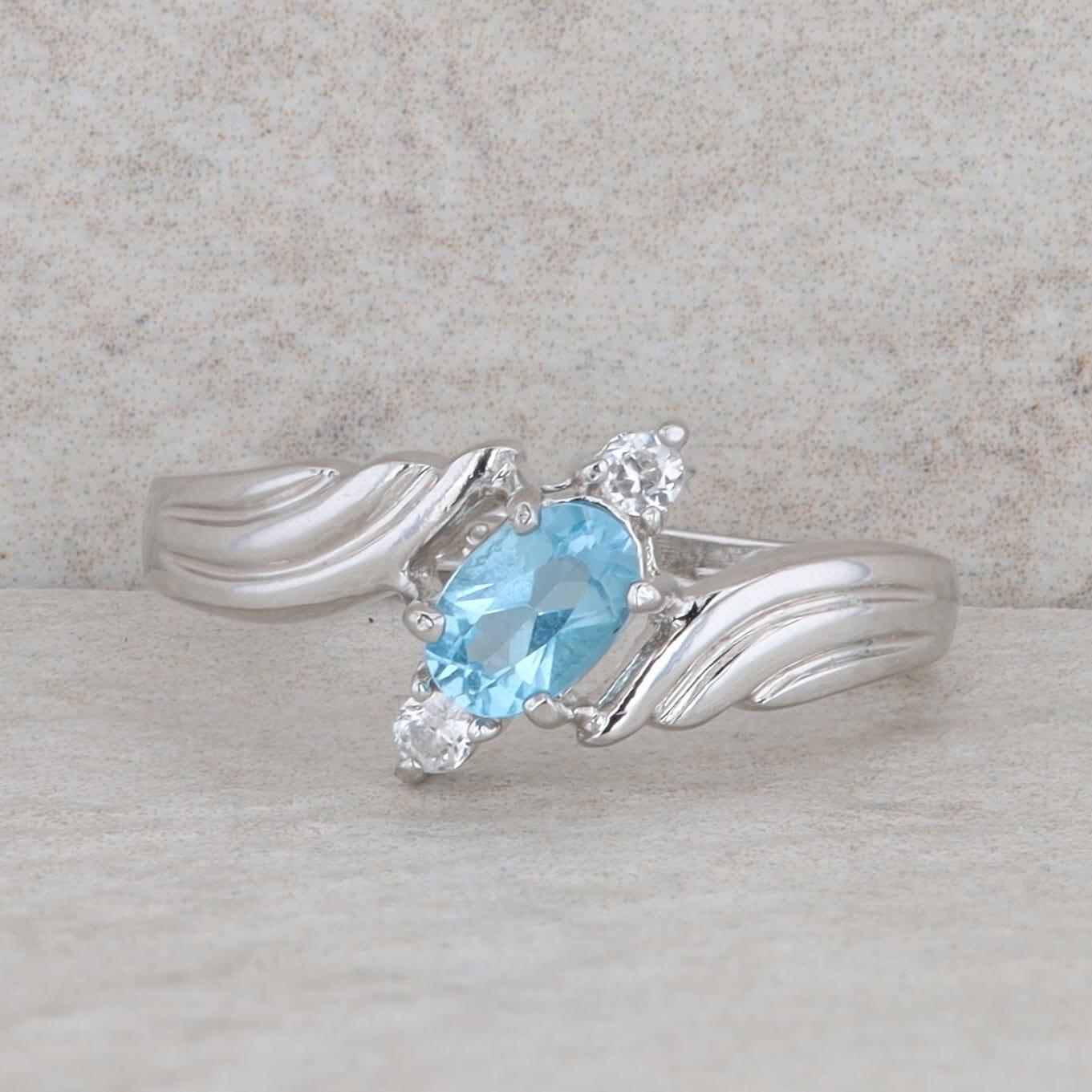 Sterling Silver Oval Blue Topaz & Round Cubic Zirconia Bypass Ring