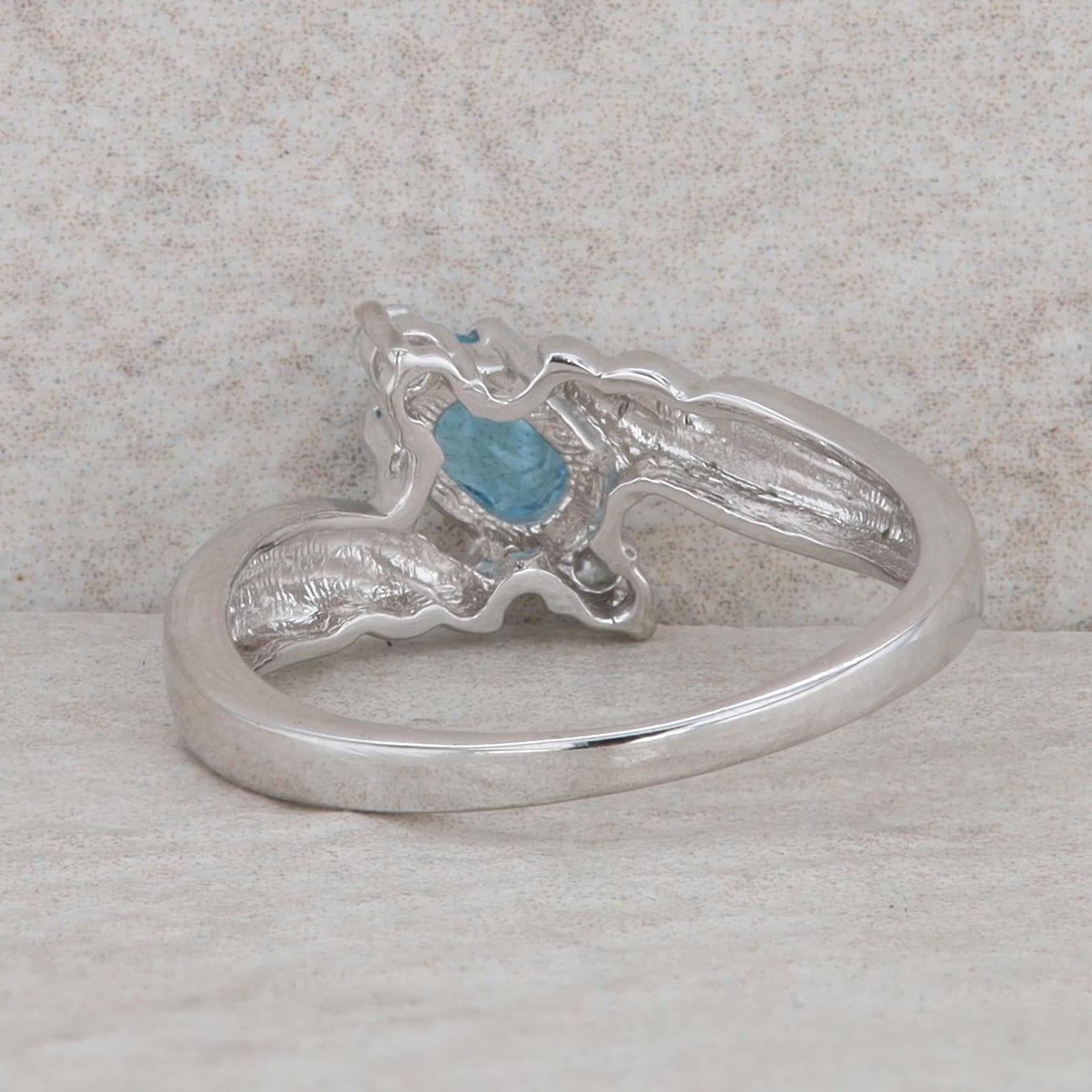 Sterling Silver Oval Blue Topaz & Round Cubic Zirconia Bypass Ring