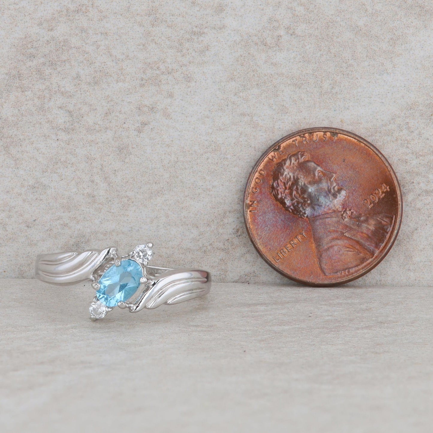 Sterling Silver Oval Blue Topaz & Round Cubic Zirconia Bypass Ring