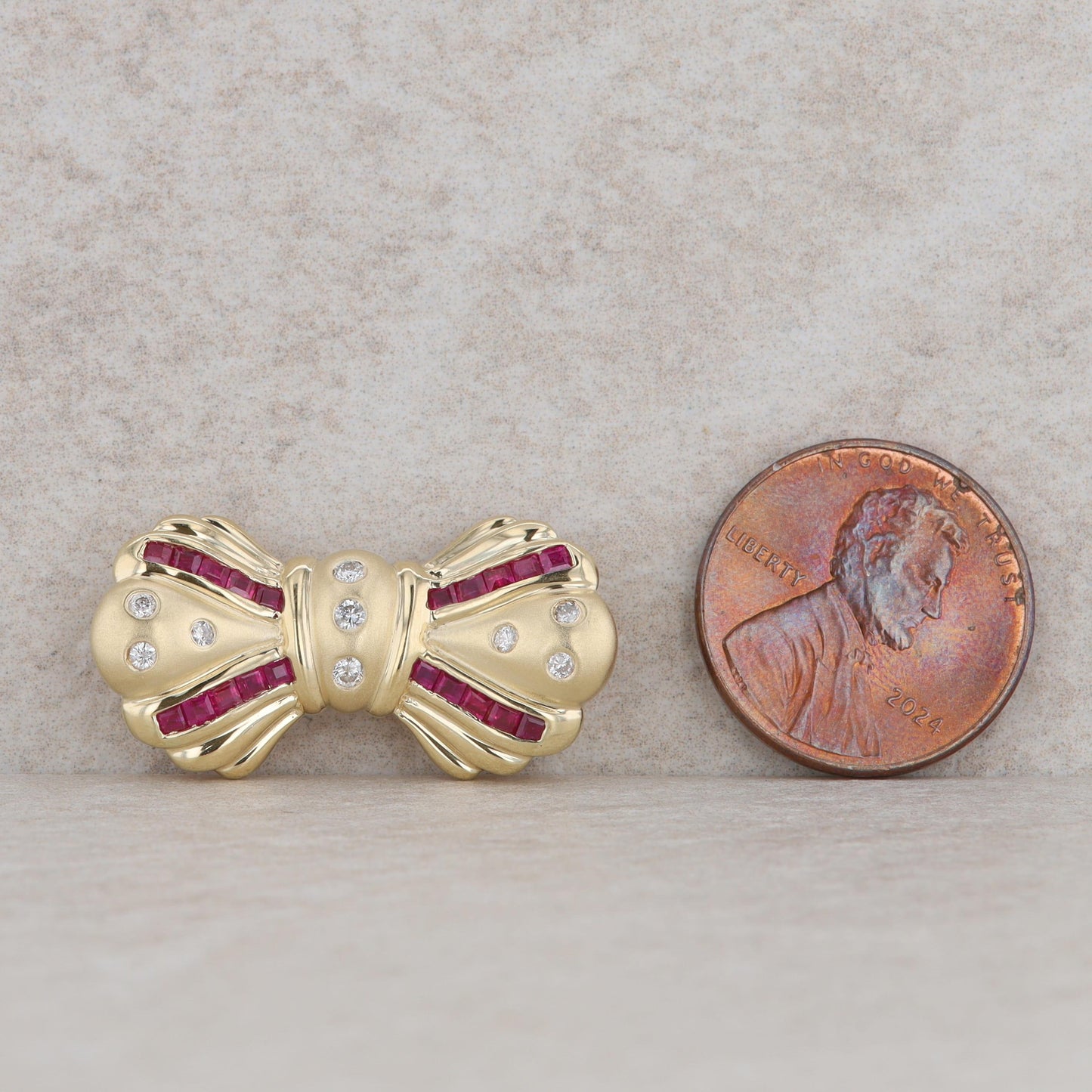 14k Yellow Gold Diamond & Square Cut Ruby Bow Pendant