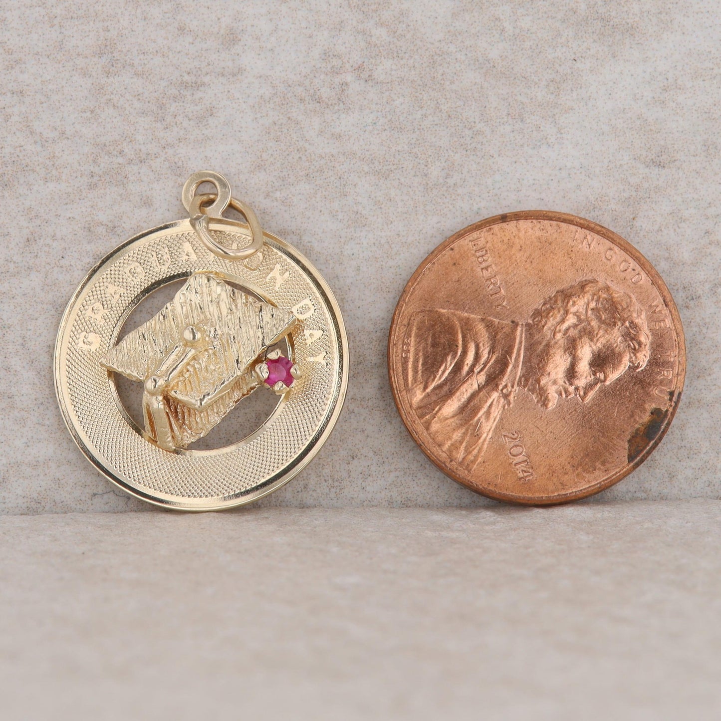14k Yellow Gold 2mm Ruby and Graduation Cap Disc Wrap 2.1g