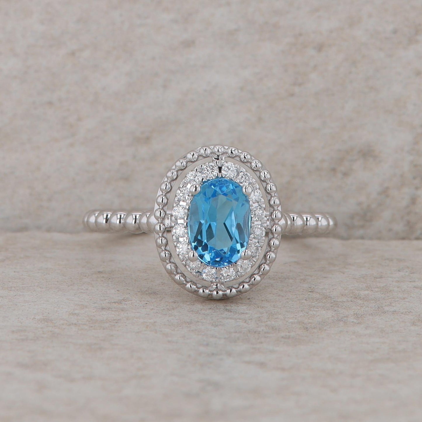 14k White Gold Diamond Halo Oval Blue Topaz Ring