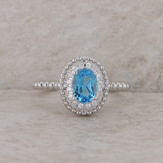 14k White Gold Diamond Halo Oval Blue Topaz Ring