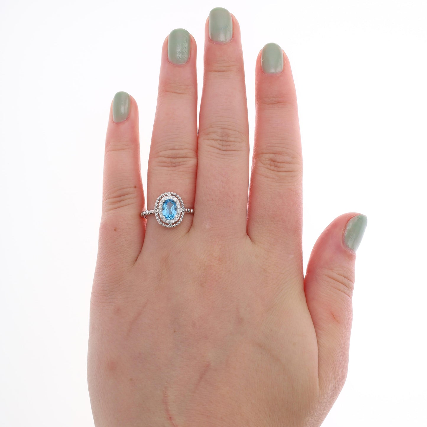 14k White Gold Diamond Halo Oval Blue Topaz Ring