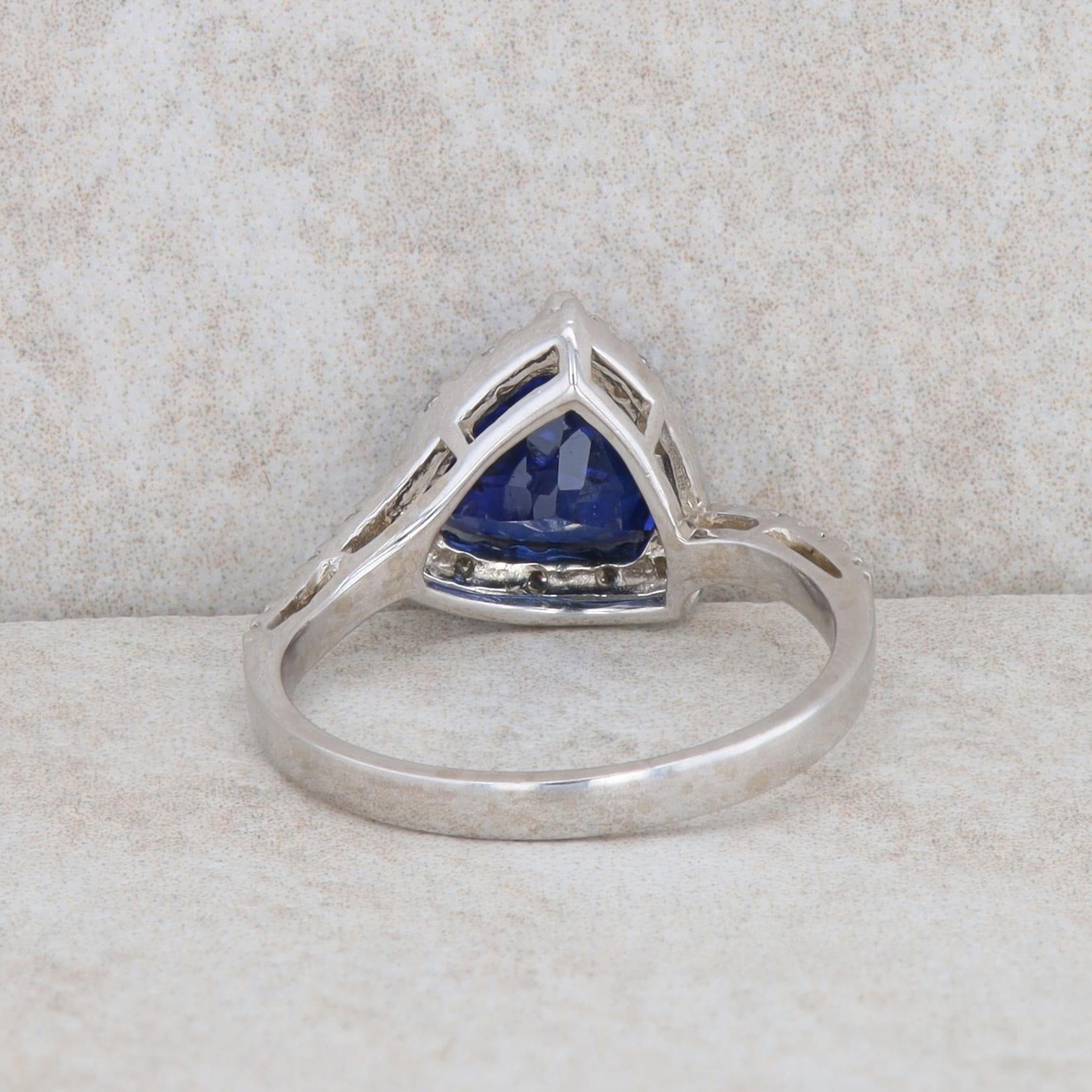 14k White Gold Synthetic Sapphire Trillion and Diamond Halo Ring