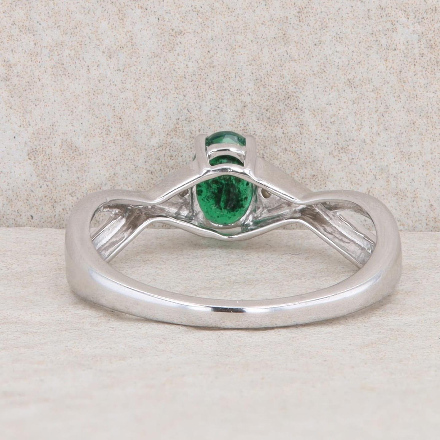 10k White Gold Diamond and Oval Emerald Twist Ring