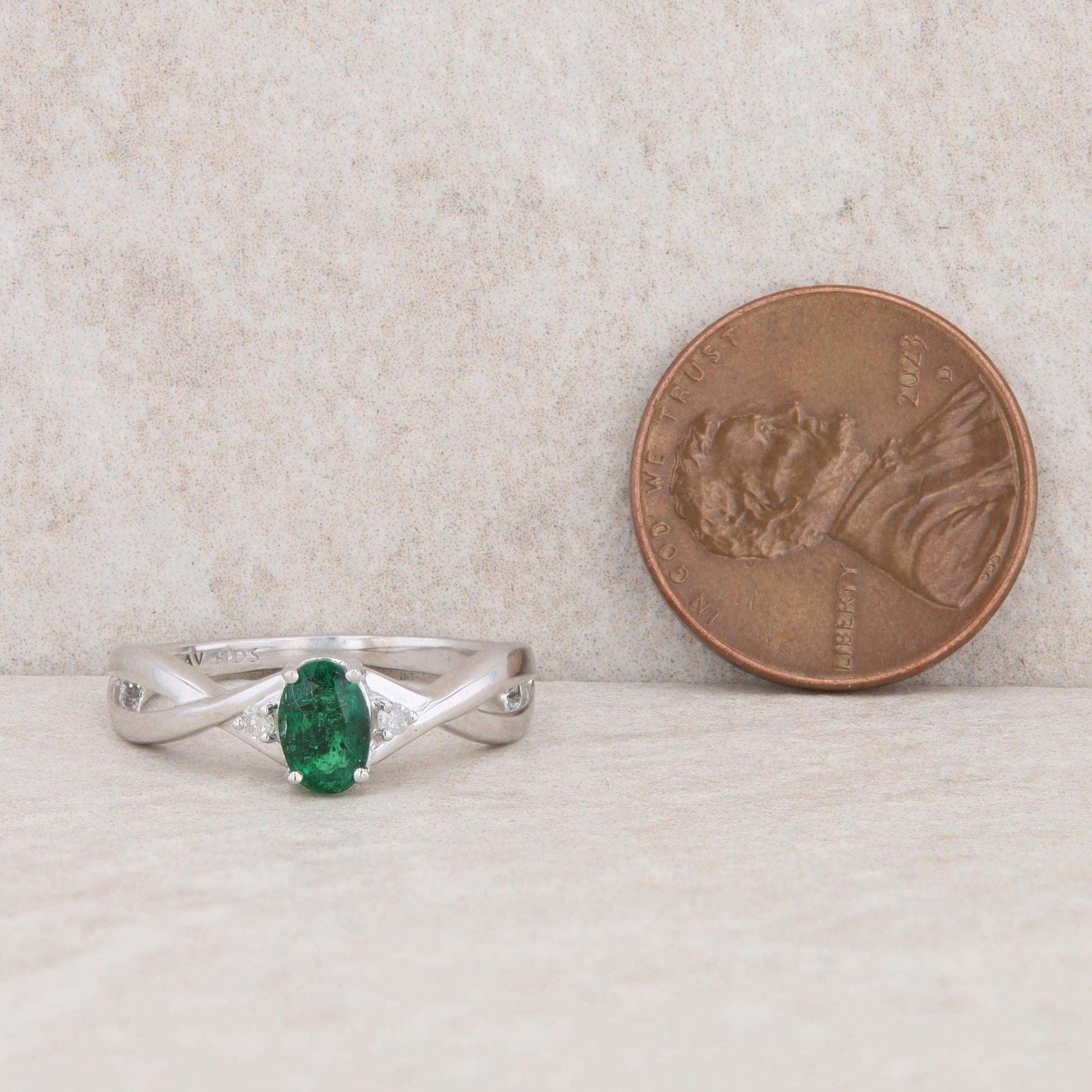 10k White Gold Diamond and Oval Emerald Twist Ring