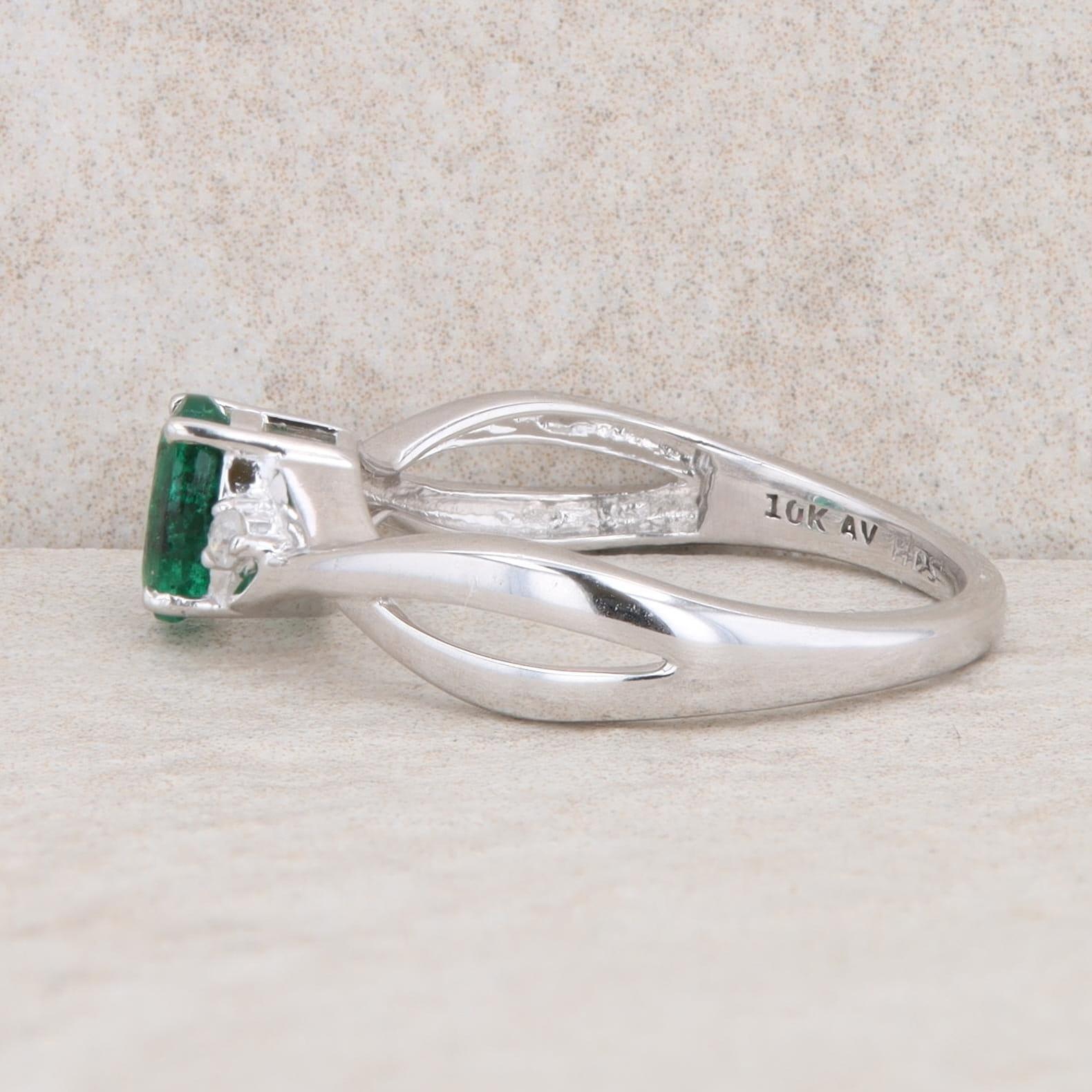 10k White Gold Diamond and Oval Emerald Twist Ring