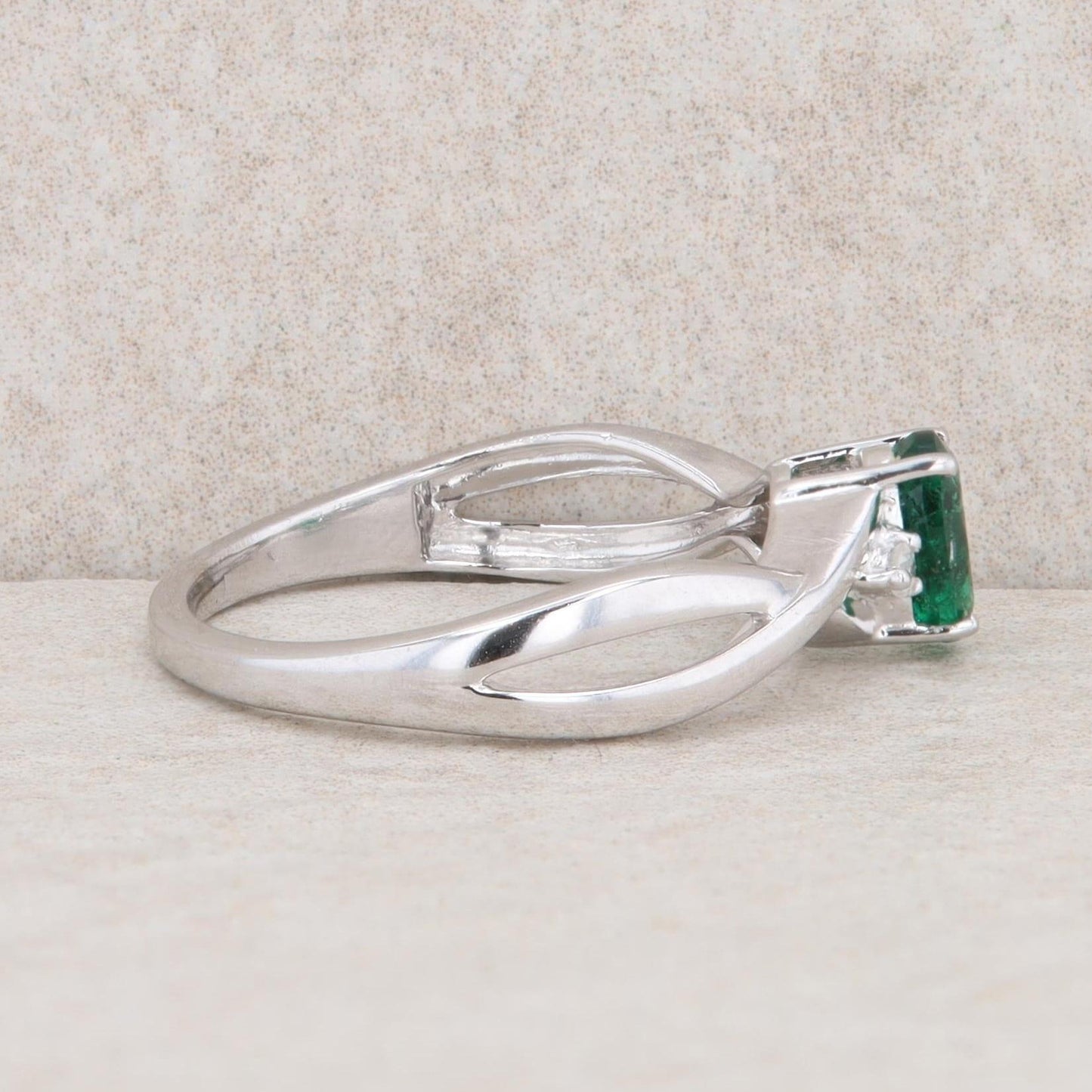 10k White Gold Diamond and Oval Emerald Twist Ring