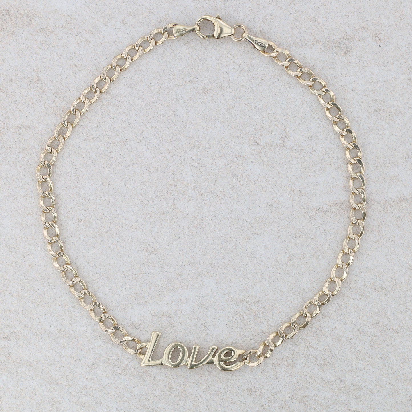 10k Yellow Gold "Love" Curb Link Bracelet 8" 2.64g