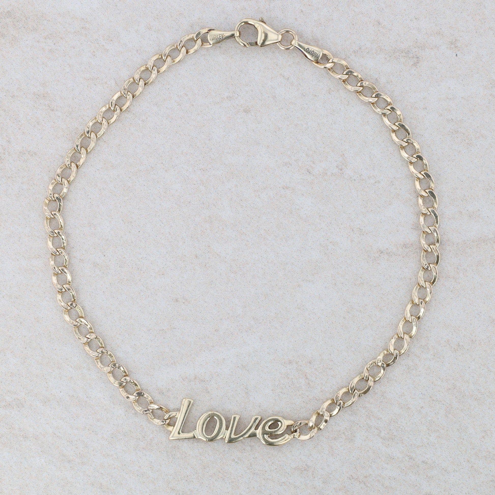 10k Yellow Gold "Love" Curb Link Bracelet 8" 2.64g