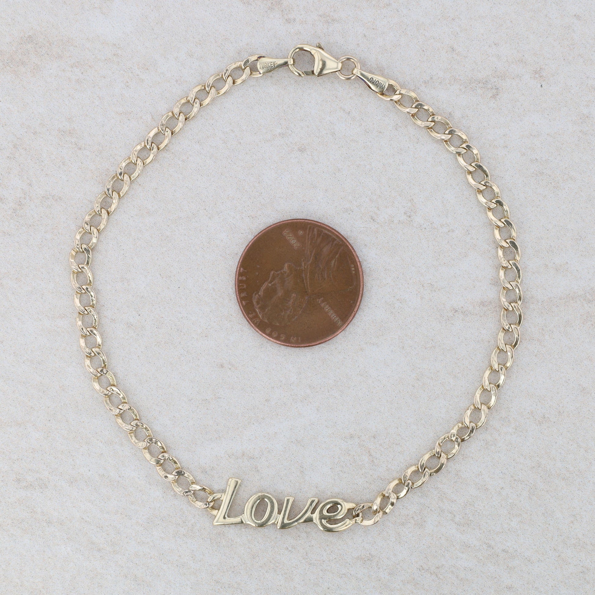 10k Yellow Gold "Love" Curb Link Bracelet 8" 2.64g