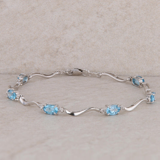 10k White Gold Blue Topaz Oval Station Bracelet