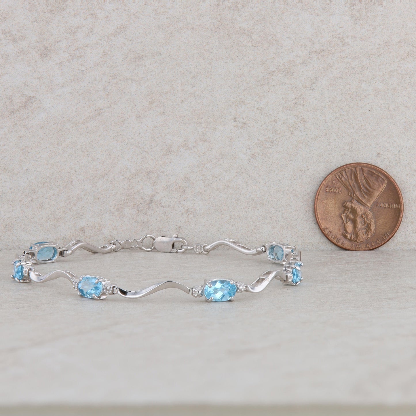 10k White Gold Blue Topaz Oval Station Bracelet