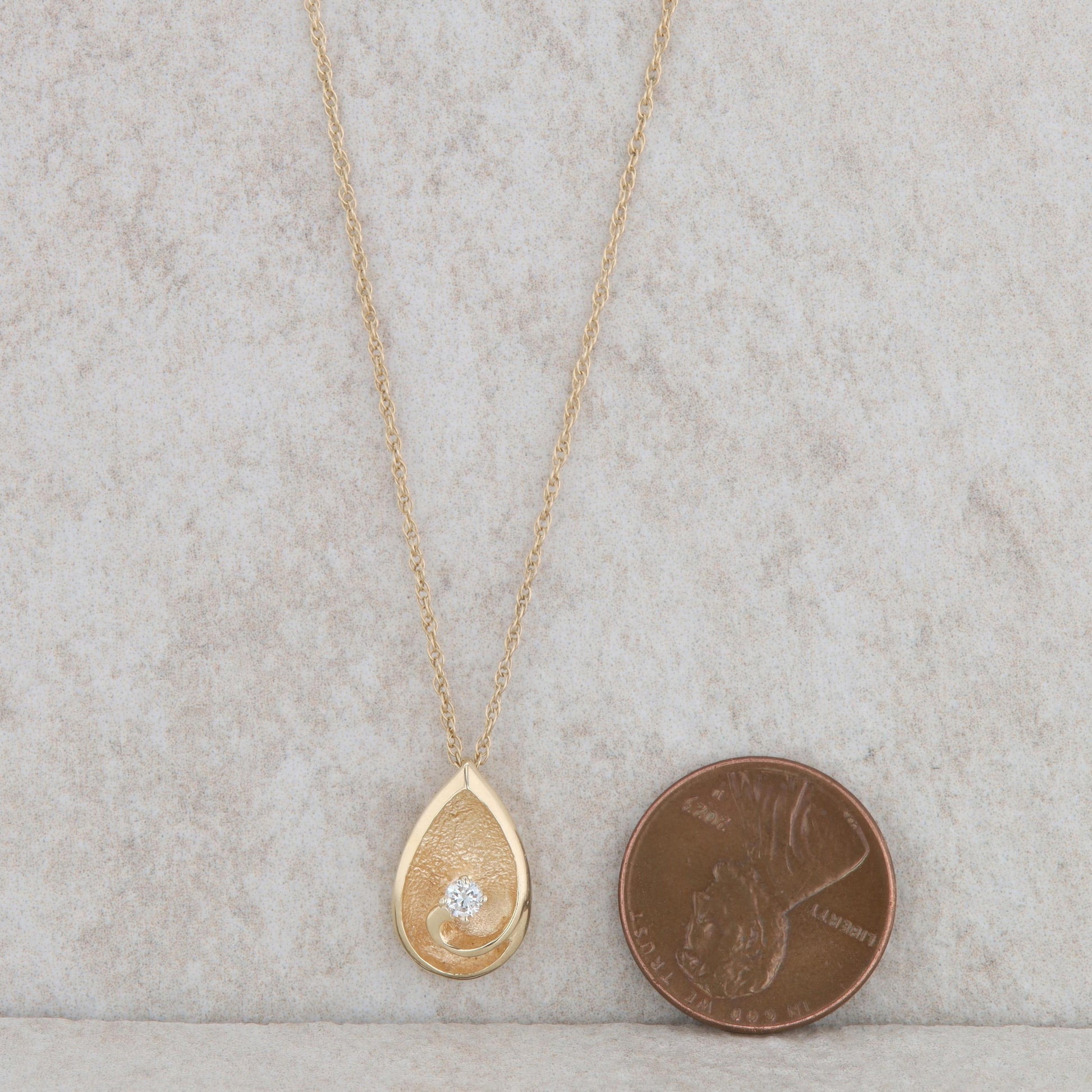 14k Yellow Gold Teardrop Swirl Diamond Necklace