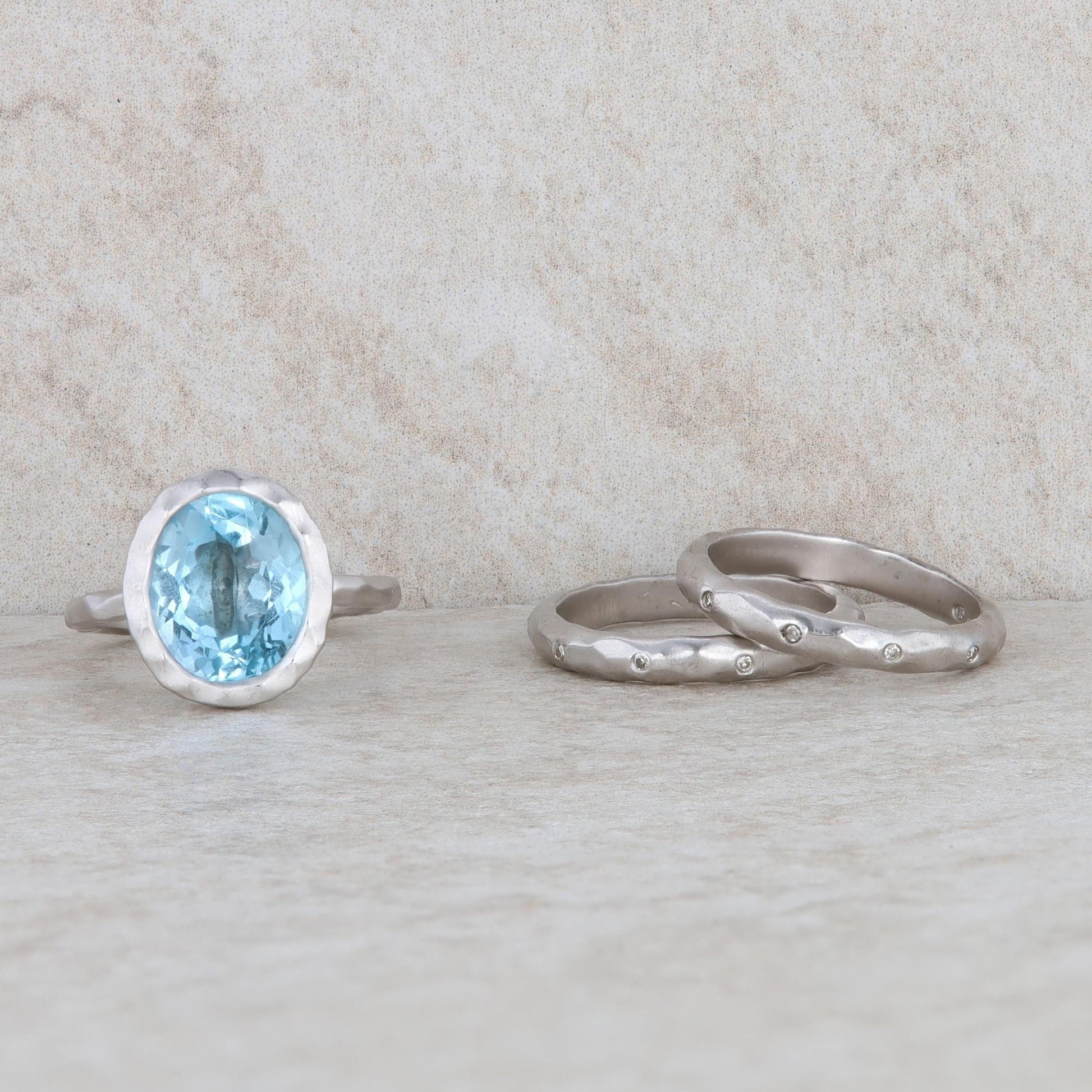 Sterling Silver Blue Topaz Ring with 2 Diamond Bands