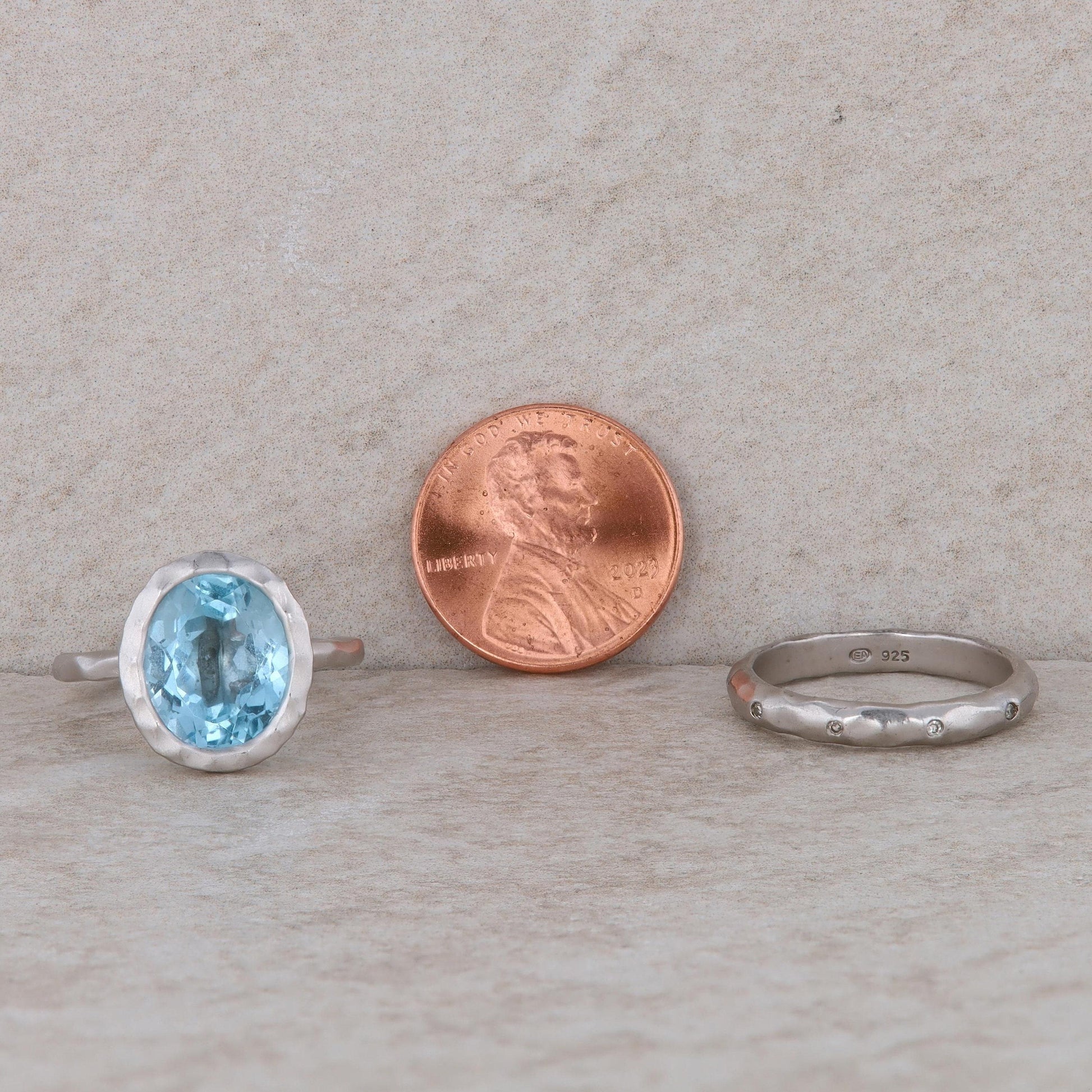 Sterling Silver Blue Topaz Ring with 2 Diamond Bands